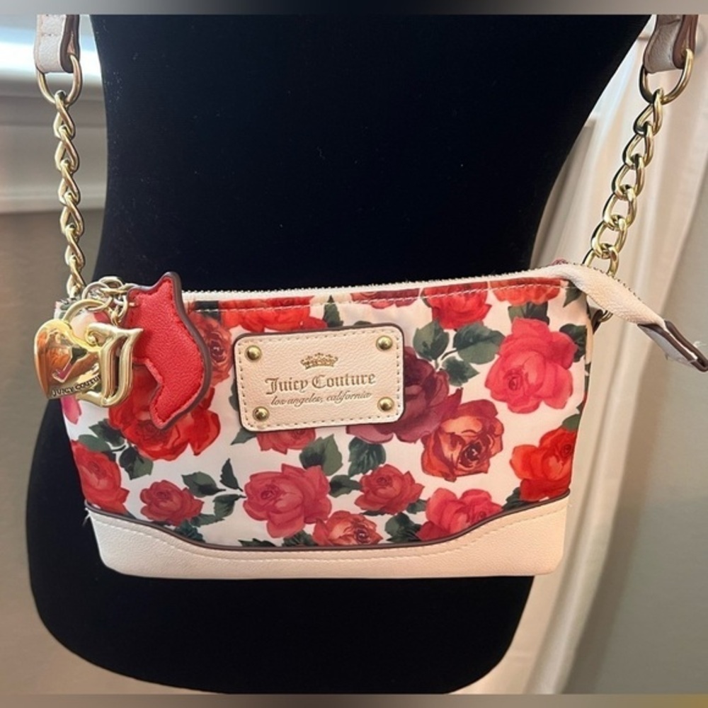 Juicy Couture pink, purple and red floral bag w/ gold chain. Measures 8" x 5".